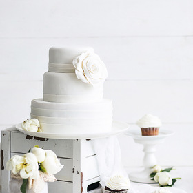    . Classic white wedding cake.